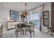 Elegant dining area with stylish chandelier, waterfront views, and sophisticated decor at 241 Riverside Dr # 601, Daytona Beach, FL 32117