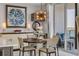 Dining space with modern decor, stylish buffet, and access to a patio with water views at 241 Riverside Dr # 601, Daytona Beach, FL 32117