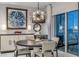 Dining room with round table set, modern chandelier and wine rack at 241 Riverside Dr # 601, Daytona Beach, FL 32117