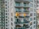 Exterior view of a condo building with balconies overlooking the city and ocean at 241 Riverside Dr # 601, Daytona Beach, FL 32117