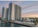Beautiful view of the condo buildings from the water featuring a pool and waterfront boardwalk at 241 Riverside Dr # 601, Daytona Beach, FL 32117