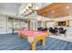 Beautiful game room with pool table, foosball table, and entertainment area at 241 Riverside Dr # 601, Daytona Beach, FL 32117