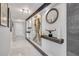Bright hallway with art niches, designer lighting, decor, and marble floors leading into the home at 241 Riverside Dr # 601, Daytona Beach, FL 32117