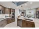 Modern kitchen with a large island, stainless steel appliances and a dining area in the background at 241 Riverside Dr # 601, Daytona Beach, FL 32117