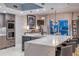 Spacious kitchen with stone countertops and stainless steel appliances overlooking waterfront view at 241 Riverside Dr # 601, Daytona Beach, FL 32117