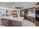 Modern kitchen with a large center island, stainless steel appliances, and lots of storage at 241 Riverside Dr # 601, Daytona Beach, FL 32117