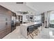 Bright kitchen featuring a large island with seating, stainless steel appliances, and modern finishes at 241 Riverside Dr # 601, Daytona Beach, FL 32117