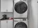 This laundry room features a stacked washer/dryer and ample storage at 241 Riverside Dr # 601, Daytona Beach, FL 32117
