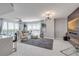 Open concept living room boasts marble floors, water views, and modern furniture with an elegant design at 241 Riverside Dr # 601, Daytona Beach, FL 32117