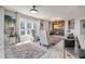 Bright living room with large windows, modern fireplace, and stylish decor and furnishings at 241 Riverside Dr # 601, Daytona Beach, FL 32117