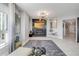 Bright living room features a modern fireplace, large windows, and stylish decor at 241 Riverside Dr # 601, Daytona Beach, FL 32117