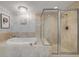 The main bathroom features a large jetted tub and a glass enclosed shower at 241 Riverside Dr # 601, Daytona Beach, FL 32117