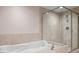 This bathroom features a soaking tub with jets and a separate glass shower at 241 Riverside Dr # 704, Holly Hill, FL 32117