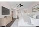 This is a bedroom with a bed, ceiling fan, and decor at 241 Riverside Dr # 704, Holly Hill, FL 32117
