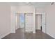 Bright bedroom with tile flooring, closet and a large window providing an abundance of natural light at 241 Riverside Dr # 704, Holly Hill, FL 32117