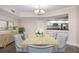 Cozy dining area features modern light fixture, seating for six, and an open view to the kitchen at 241 Riverside Dr # 704, Holly Hill, FL 32117