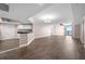 The open living room boasts wood-look floors and access to a balcony with incredible water views at 241 Riverside Dr # 704, Holly Hill, FL 32117