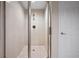 Walk-in shower with tile surround and glass enclosure providing a spa-like experience at 241 Riverside Dr # 704, Holly Hill, FL 32117