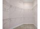 This walk-in closet features metal shelving at 241 Riverside Dr # 704, Holly Hill, FL 32117