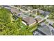 Aerial view of a home with a covered patio and fire pit in a serene neighborhood at 2454 Hyatt Creek Ln, Port Orange, FL 32128