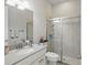Clean bathroom with vanity, quartz countertop, modern fixtures, and a glass-enclosed shower at 2454 Hyatt Creek Ln, Port Orange, FL 32128