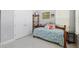 Stylish bedroom showcasing closet, display cabinet, and floral bedding at 2454 Hyatt Creek Ln, Port Orange, FL 32128