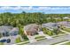 Expansive house with lush landscaping, striking architectural features, and circular driveway at 2454 Hyatt Creek Ln, Port Orange, FL 32128