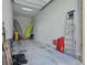Spacious garage perfect for storage and hobbies, complete with surfboard and other beach essentials at 2454 Hyatt Creek Ln, Port Orange, FL 32128
