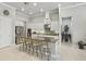 Open kitchen with a granite island, modern white cabinetry, and stainless steel appliances at 2454 Hyatt Creek Ln, Port Orange, FL 32128