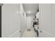 Well-organized laundry room with modern appliances, storage cabinets, and tile flooring at 2454 Hyatt Creek Ln, Port Orange, FL 32128