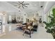 Expansive living room featuring an open layout, marble floors, and stylish decor with a piano on the left at 2454 Hyatt Creek Ln, Port Orange, FL 32128