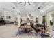 Spacious living room featuring an open layout, marble floors, and view into the modern kitchen and dining area at 2454 Hyatt Creek Ln, Port Orange, FL 32128