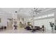 Open living area with a tray ceiling, ceiling fan, and seamless flow to the kitchen at 2454 Hyatt Creek Ln, Port Orange, FL 32128