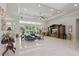 Spacious living room with marble floors, recessed lights, and backyard views through large sliding glass doors at 2454 Hyatt Creek Ln, Port Orange, FL 32128