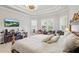 Spacious main bedroom features tray ceiling, plantation shutters, sitting area and view of TV at 2454 Hyatt Creek Ln, Port Orange, FL 32128