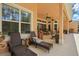 Inviting outdoor patio featuring lounge chairs, ceiling fans, and stylish decor at 2454 Hyatt Creek Ln, Port Orange, FL 32128