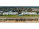 Aerial view showcasing a condo complex and pool near the beach at 2480 Ocean Shore Blvd # 120, Ormond Beach, FL 32176