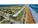 Amazing aerial view of beachside property with private parking and refreshing community pool at 2480 Ocean Shore Blvd # 120, Ormond Beach, FL 32176