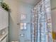 Bathroom with a decorative seashell-themed shower curtain and matching wall decor at 2480 Ocean Shore Blvd # 120, Ormond Beach, FL 32176