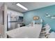 Well-equipped kitchen with stainless steel appliances and a long countertop for easy meal preparation at 2480 Ocean Shore Blvd # 120, Ormond Beach, FL 32176