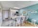 Bright kitchen featuring a breakfast bar with seating, modern appliances, and ample counter space at 2480 Ocean Shore Blvd # 120, Ormond Beach, FL 32176