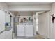Functional laundry room equipped with washer, dryer, and ample storage space at 2480 Ocean Shore Blvd # 120, Ormond Beach, FL 32176