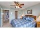 Relaxing bedroom with coastal decor, soft lighting, and easy access to the other rooms at 2480 Ocean Shore Blvd # 120, Ormond Beach, FL 32176