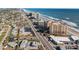 Scenic aerial view of beachfront condos near a highway, showcasing both convenience and luxury at 2515 S Atlantic Ave # 509, Daytona Beach, FL 32118