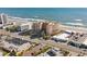 Aerial view of a condominium complex featuring well-maintained grounds, a pool, and convenient parking at 2515 S Atlantic Ave # 509, Daytona Beach, FL 32118