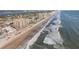 Beautiful aerial view of a beachfront condominium complex next to the ocean and city at 2515 S Atlantic Ave # 509, Daytona Beach, FL 32118