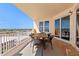Spacious balcony offering stunning city views, complete with outdoor dining set and ample seating at 2515 S Atlantic Ave # 509, Daytona Beach, FL 32118