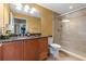 Bathroom features a single vanity with granite countertop and glass enclosed shower at 2515 S Atlantic Ave # 509, Daytona Beach, FL 32118