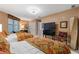 Bright bedroom with two beds, television and decor accents at 2515 S Atlantic Ave # 509, Daytona Beach, FL 32118