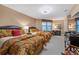 Bright bedroom with two beds, sitting area and TV at 2515 S Atlantic Ave # 509, Daytona Beach, FL 32118